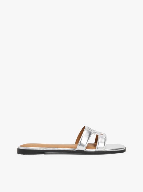 Mules-de-cuero-metalizada-con-monograma-TH