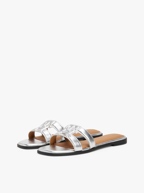 Mules-de-cuero-metalizada-con-monograma-TH